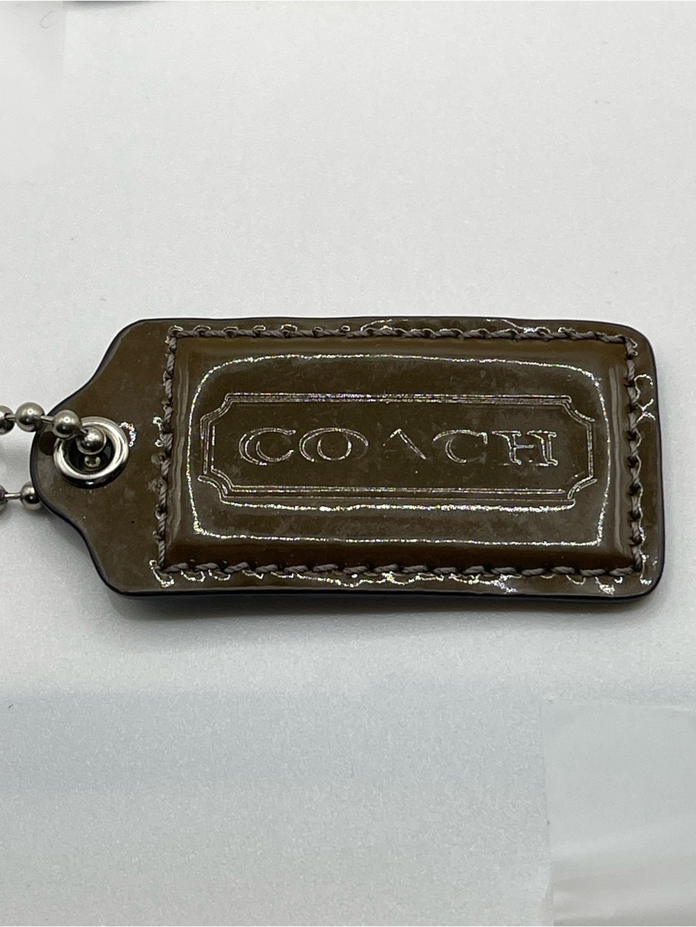 COACH Patent Leather Hang Tag Brown and Iridescent Gray